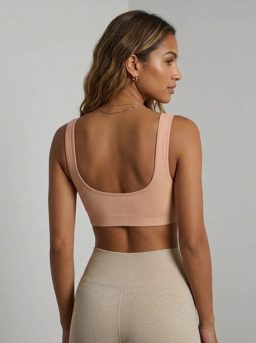 MODA AI output — back close-up of model in blush seamless bralette, demonstrating scoop back construction, rib detail, and color accuracy on a different skin tone