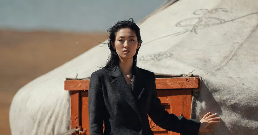 MODA AI editorial photography — model in dramatic Mongolian steppe landscape demonstrating AI catalog range for Shopify brands
