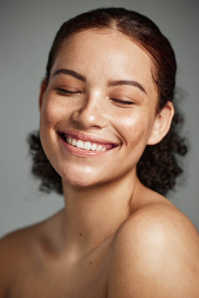 Face reference — woman with curly hair and warm smile